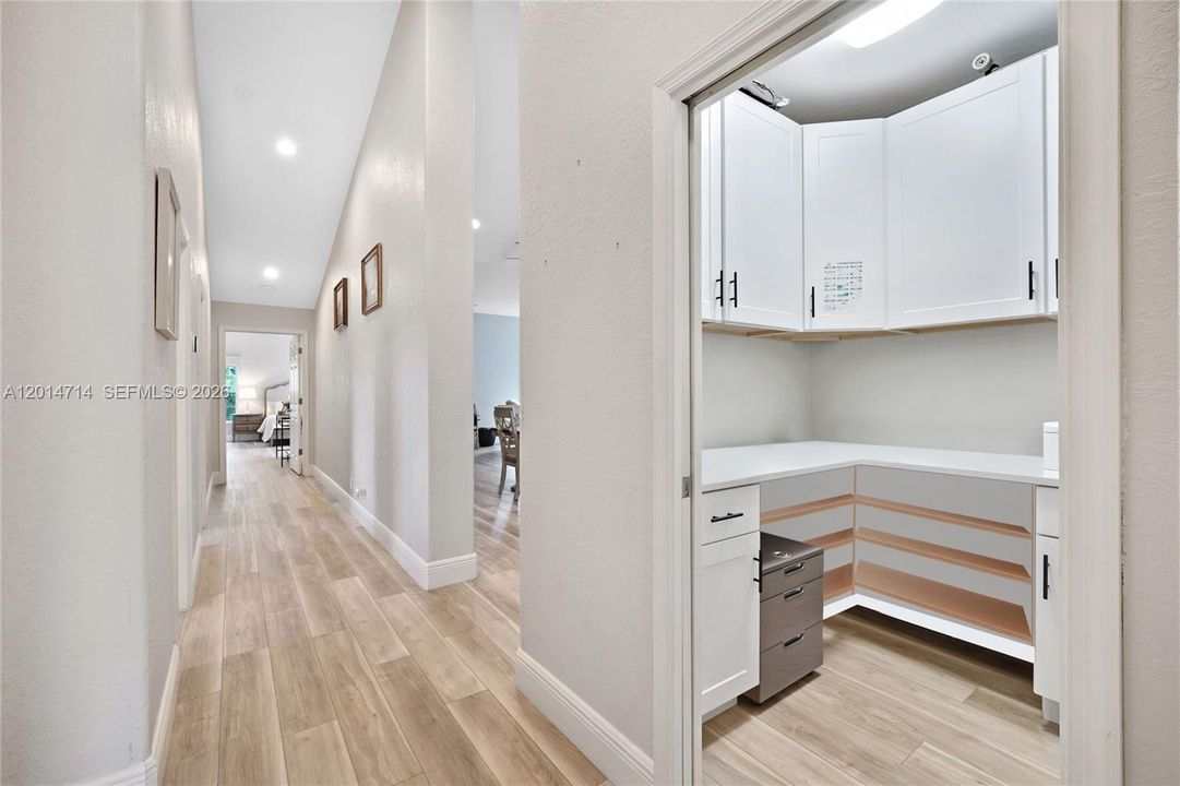 Hallway and built-in  office space with sliding door