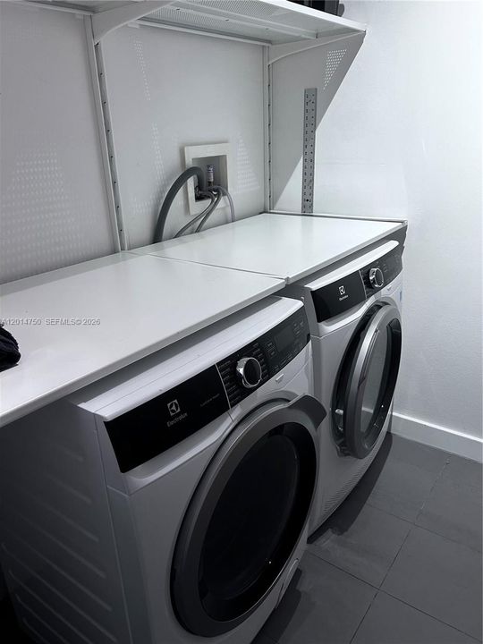New Washer and Dryerwith folding surface & custom storage.