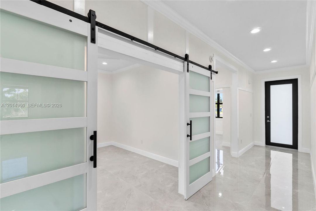 Built in den and sliding barn door details
