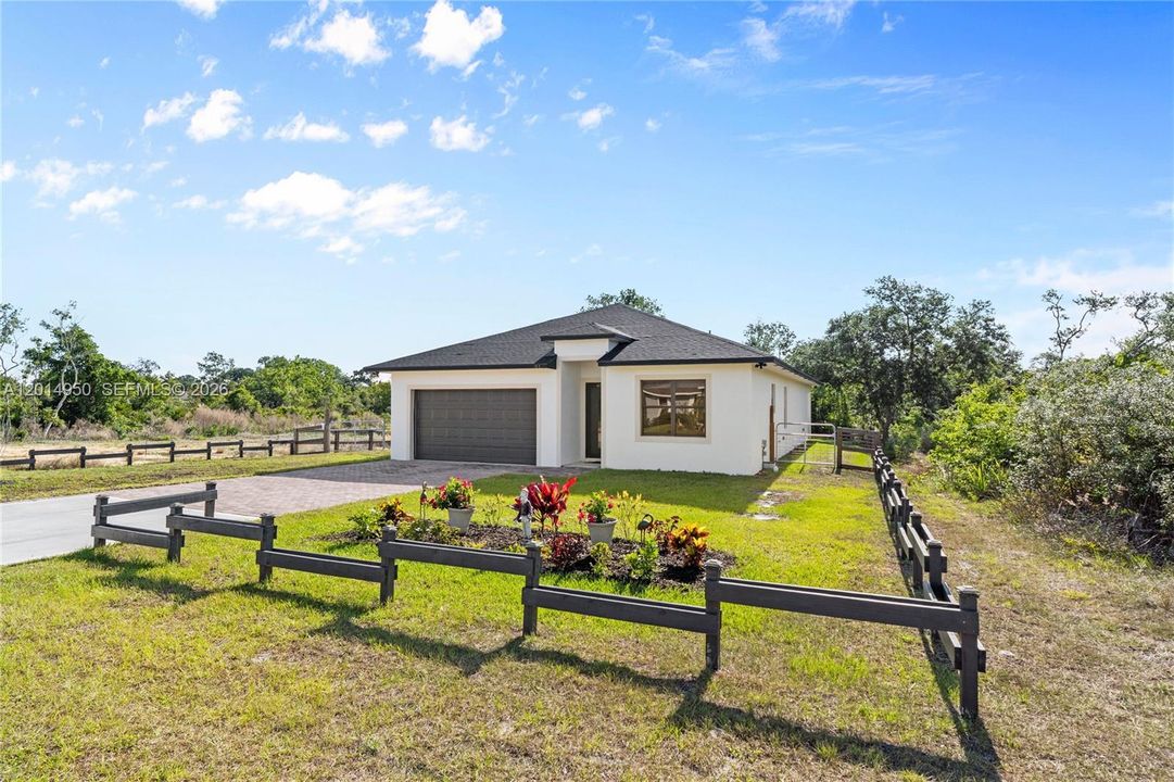 Front exterior with fenced entry