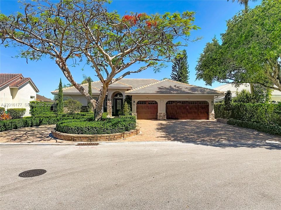 Circular drive with beautiful landscaping