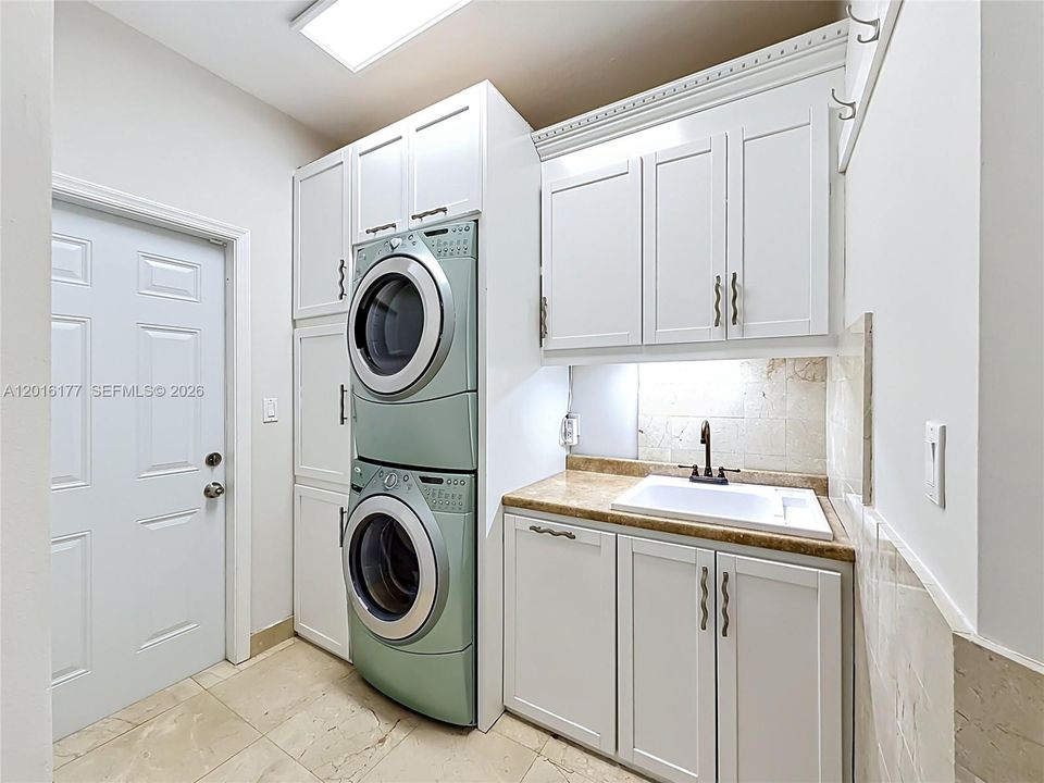 Laundry with built-ins and utility sink
