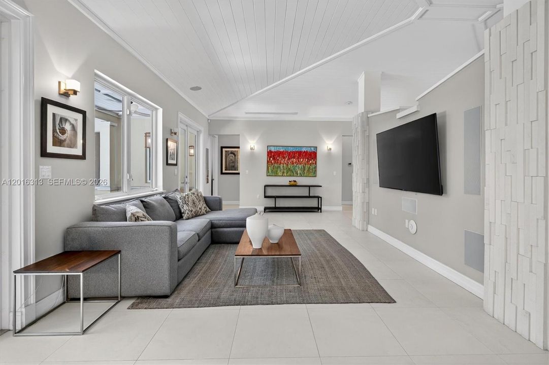 Energy-efficient smart home upgrades including Tesla solar panels with backup batteries and zoned A/C systems for lower utility costs and storm preparedness.
