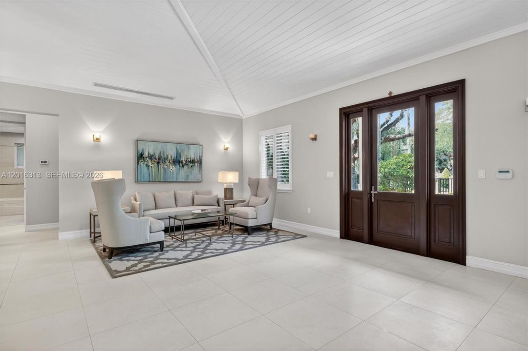 Designer details throughout including custom millwork, solid wood 8-foot doors, state-of-the-art audio system, and refined contemporary finishes.