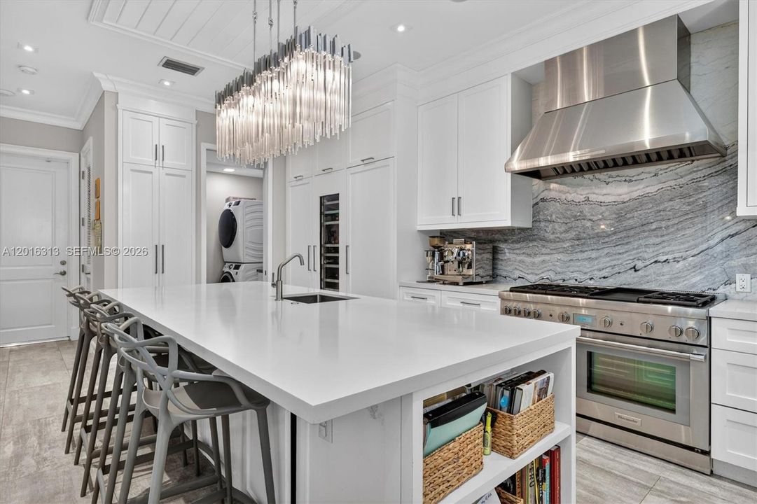 Chef’s kitchen and open-concept floor plan ideal for luxury entertaining, family gatherings, and indoor-outdoor living.