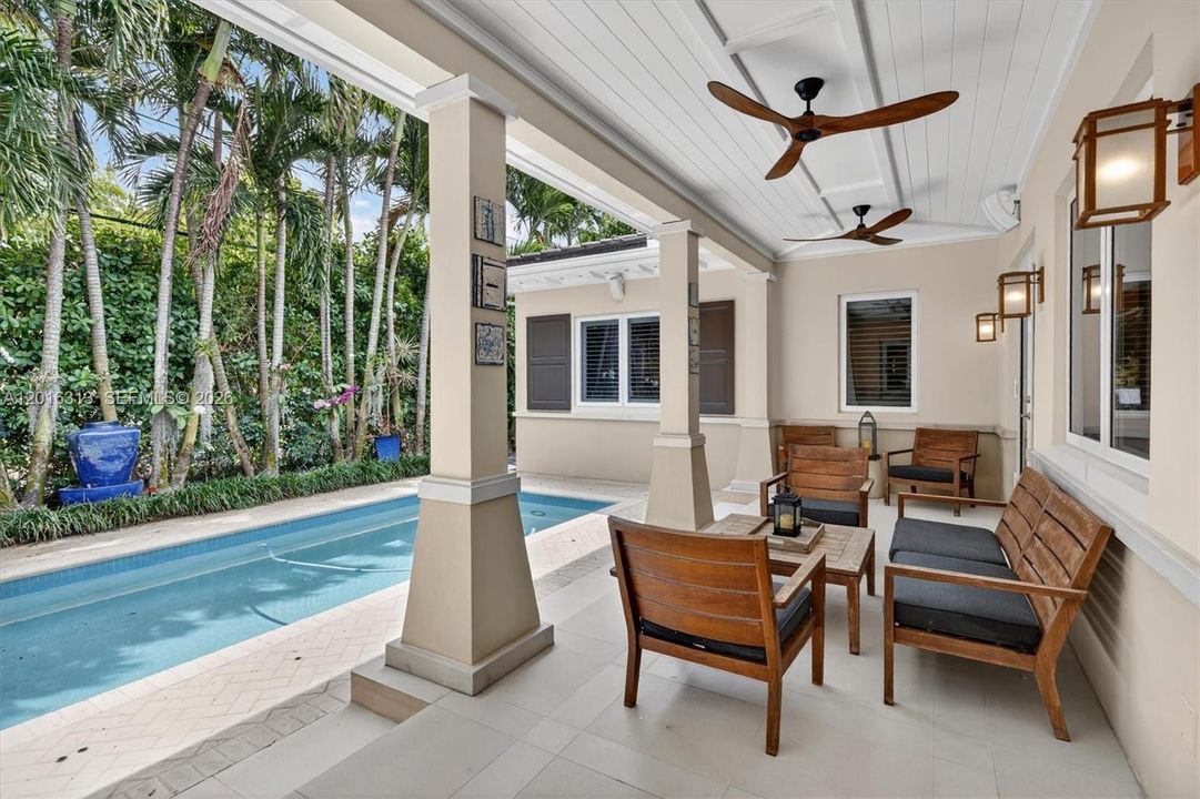 Luxury outdoor lifestyle with summer kitchen, barbecue area, expansive deck, patio, fruit trees, and beautifully designed entertaining spaces.