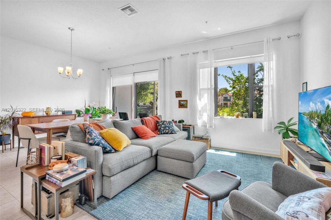 Living and Dining Areas with large Window & Glass Sliding Doors