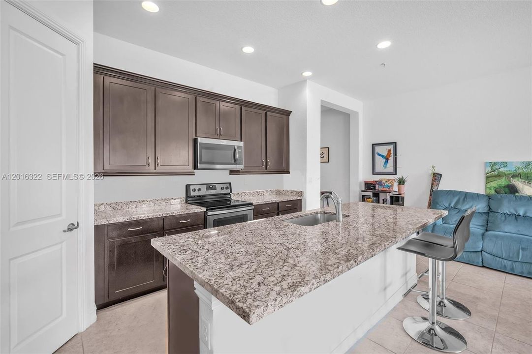 Kitchen with Large Single Basin & Dark Cabinets