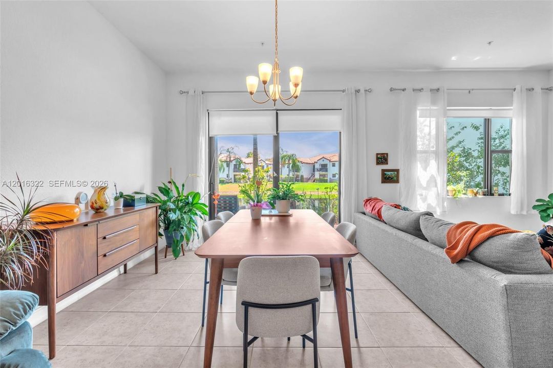 Dining Area with Chandelier & Lake View
