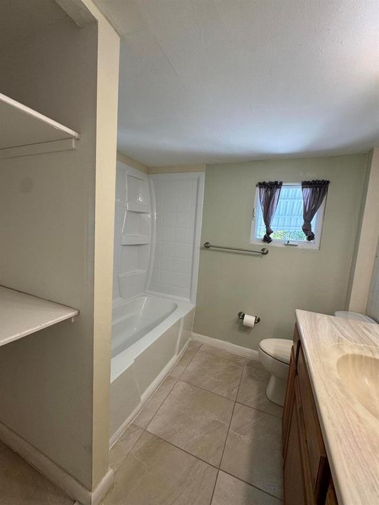 Bathroom 1 with shelving