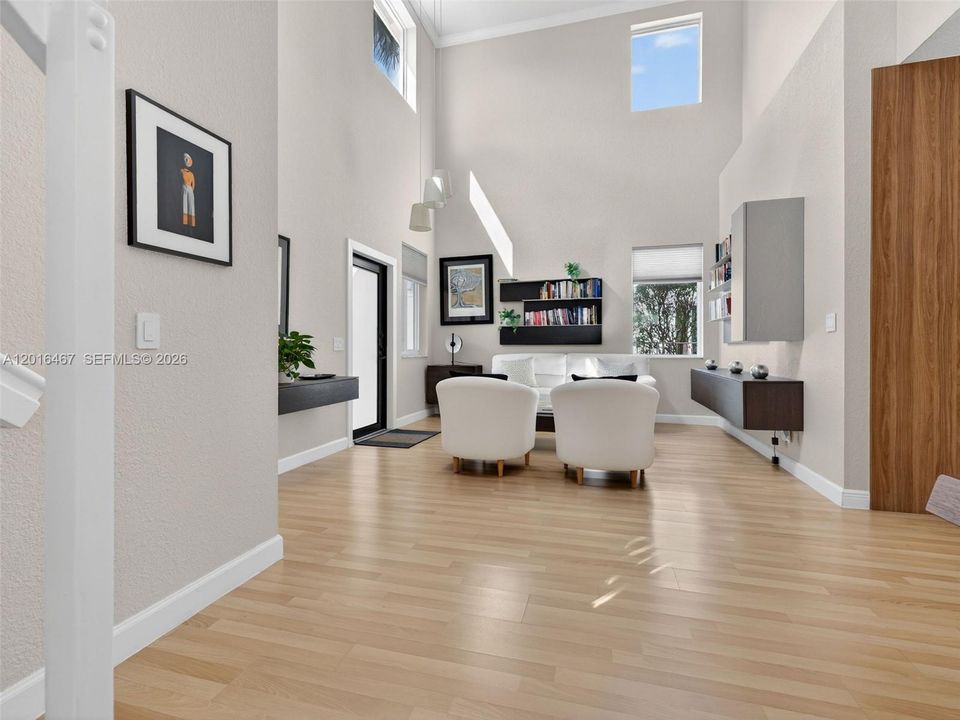 Double height ceilings in living room area.