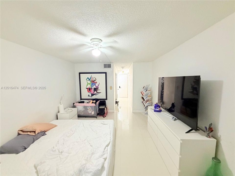 half a bath and a large foyer area pass through window from kitchen to dining area