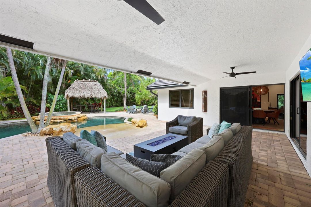 Expansive Patio Overlooks Backyard Oasis