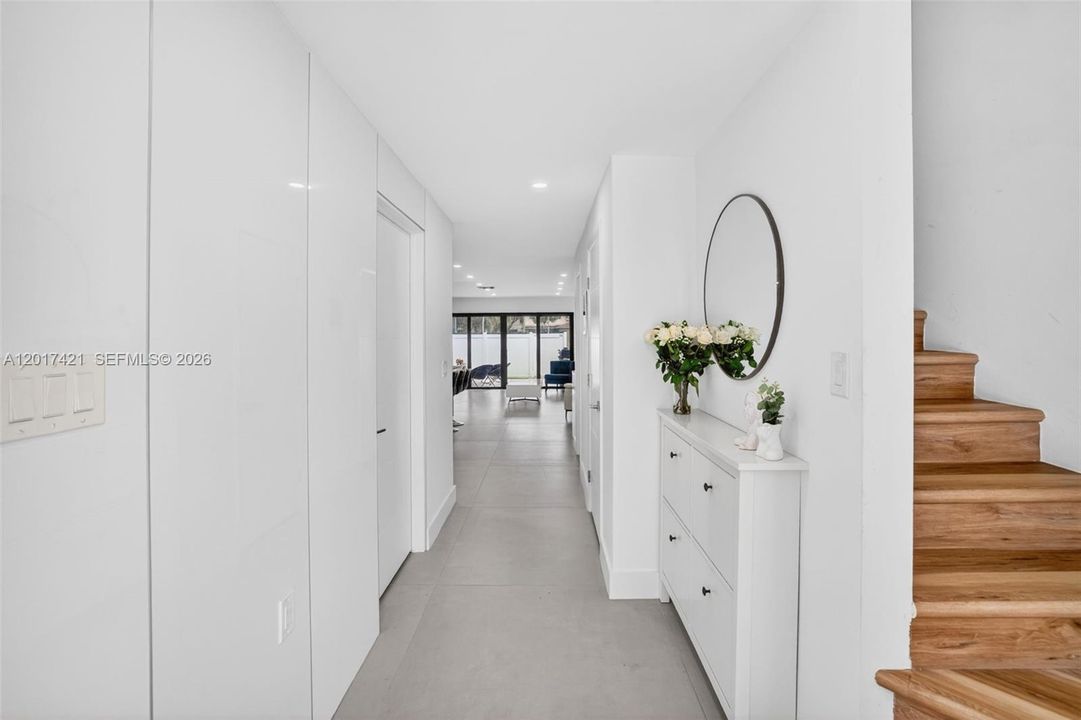 Foyer entrance with stairs leading up to 3 bedrooms & 2 bathrooms