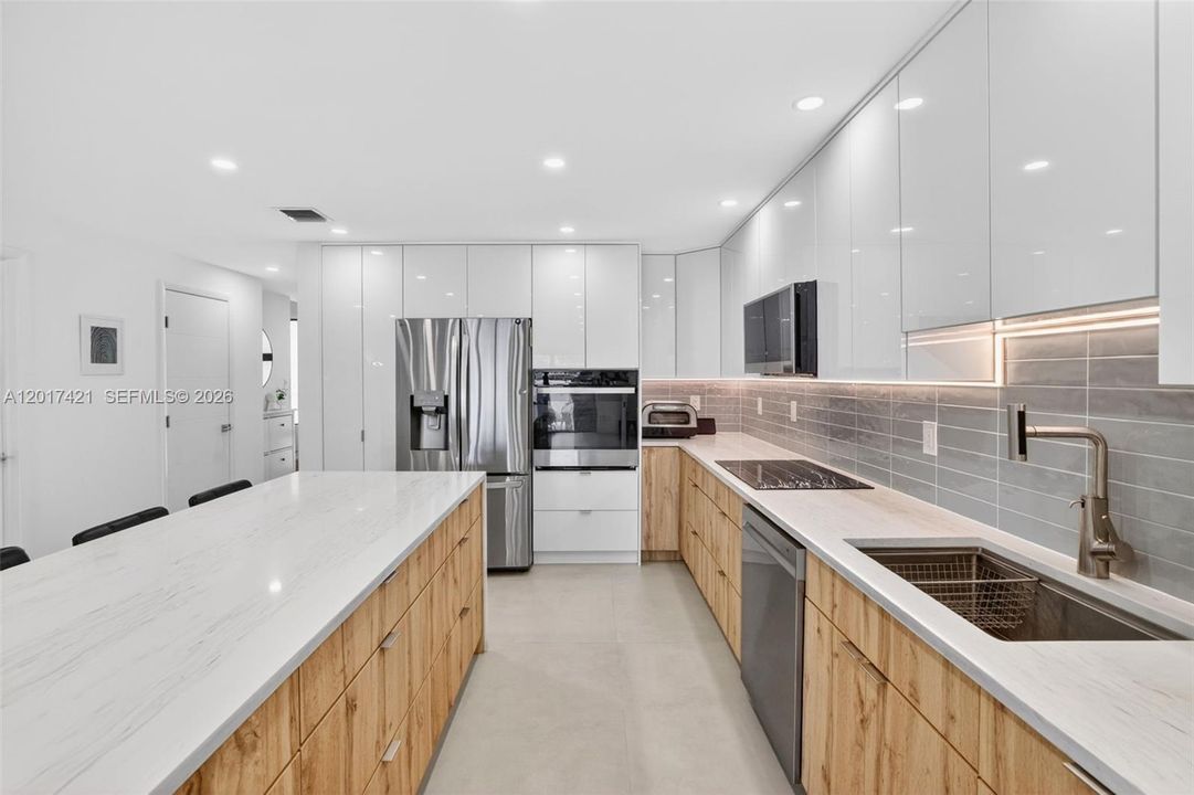 Oversized kitchen sink and tons of storage cabinets and drawers