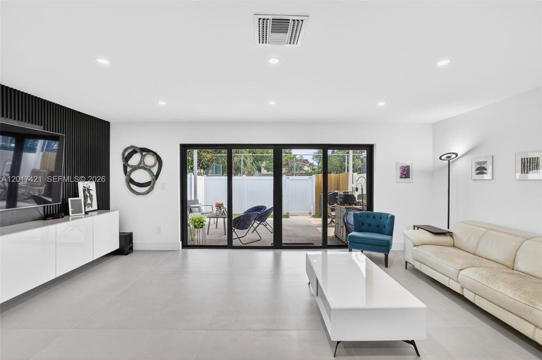 Oversized family room / great room (room for dining area as well (just move sofa closer to TV and add it behind)