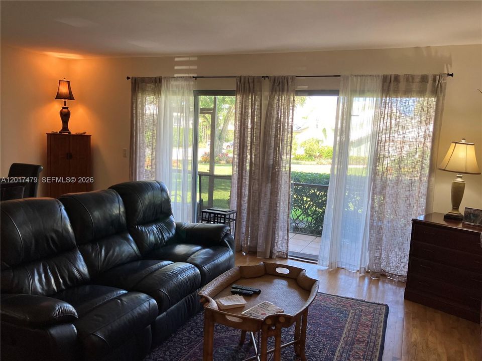 Bright Living/Dining area with private screen porch