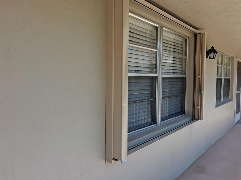 Front windows with Shutters