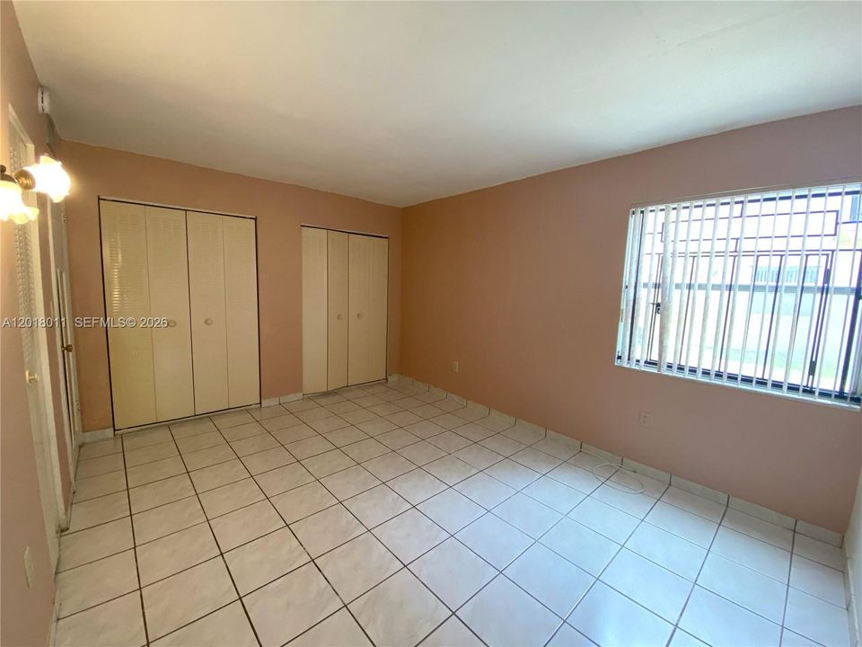 Primary bedroom with wall to wall closet space + additional closet are inside room