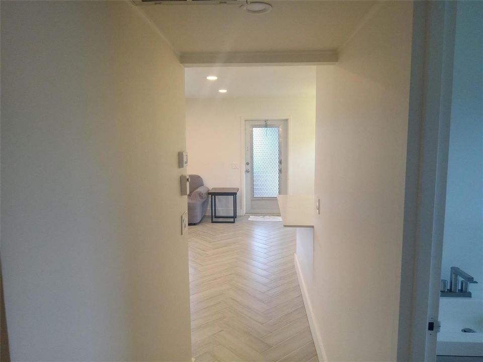 view from bedrooms hallway to front door