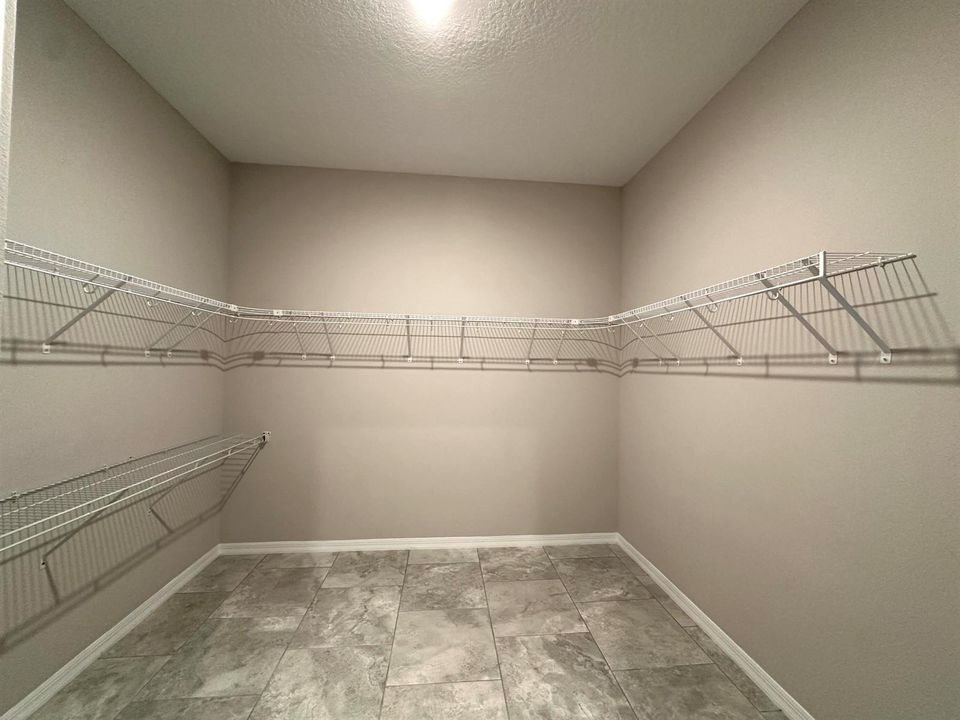 WALK-IN CLOSET IN MASTER BEDROOM