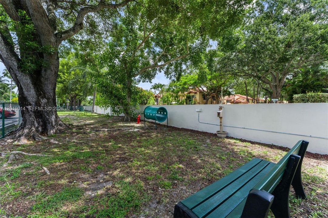Relax and watch your doggies play in their very own "Pet Paws" park at Venetian Palms