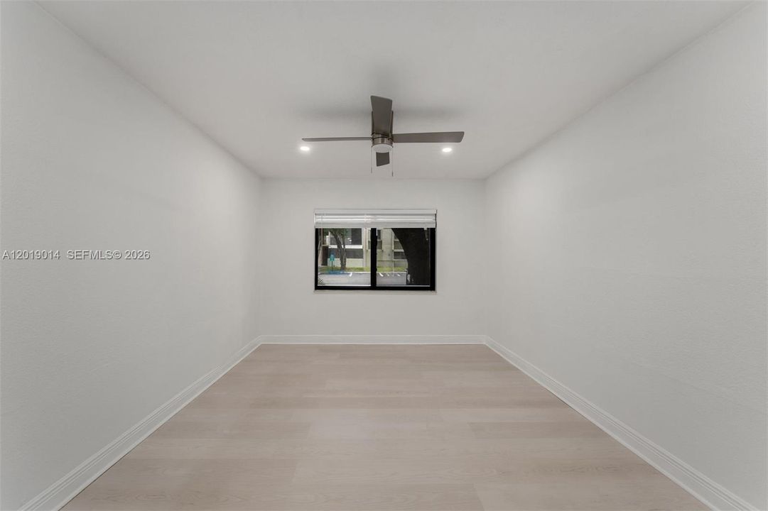Spacious Primary Suite with En-suite bathroom and custom walk-in closet.