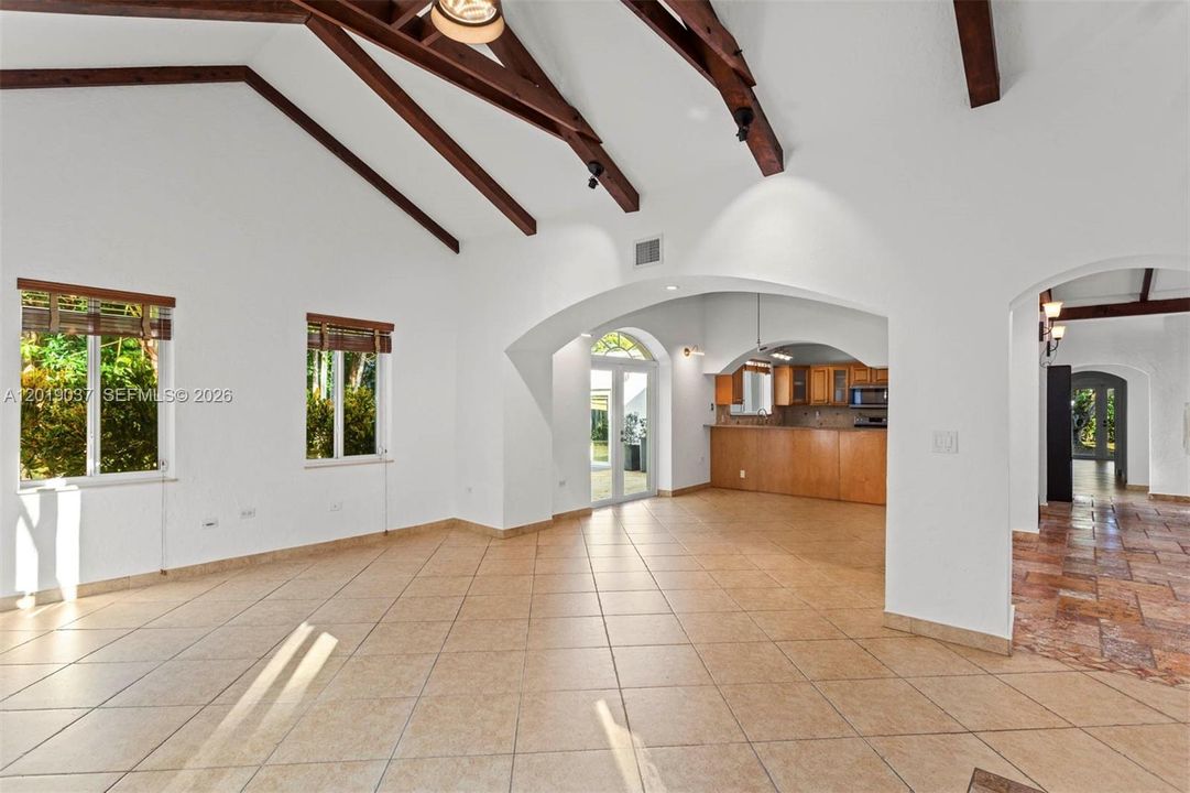 family, dining  and kitchen area, conveniently design with an open floor plan , and impressive cathedral ceiling.