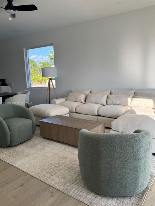 It is being sold unfurnished; the furnishings are shown for visualization purposes only.