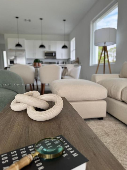 It is being sold unfurnished; the furnishings are shown for visualization purposes only.