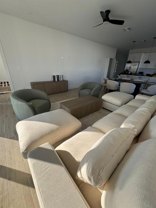 It is being sold unfurnished; the furnishings are shown for visualization purposes only.