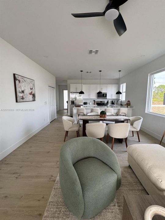 It is being sold unfurnished; the furnishings are shown for visualization purposes only.