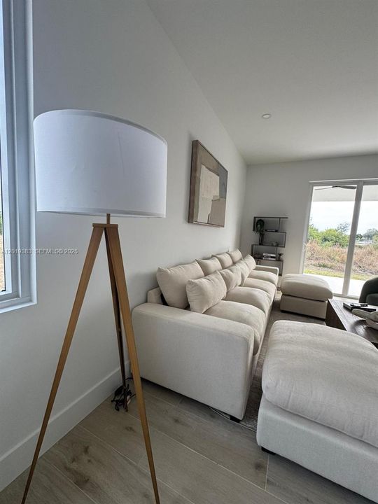 It is being sold unfurnished; the furnishings are shown for visualization purposes only.