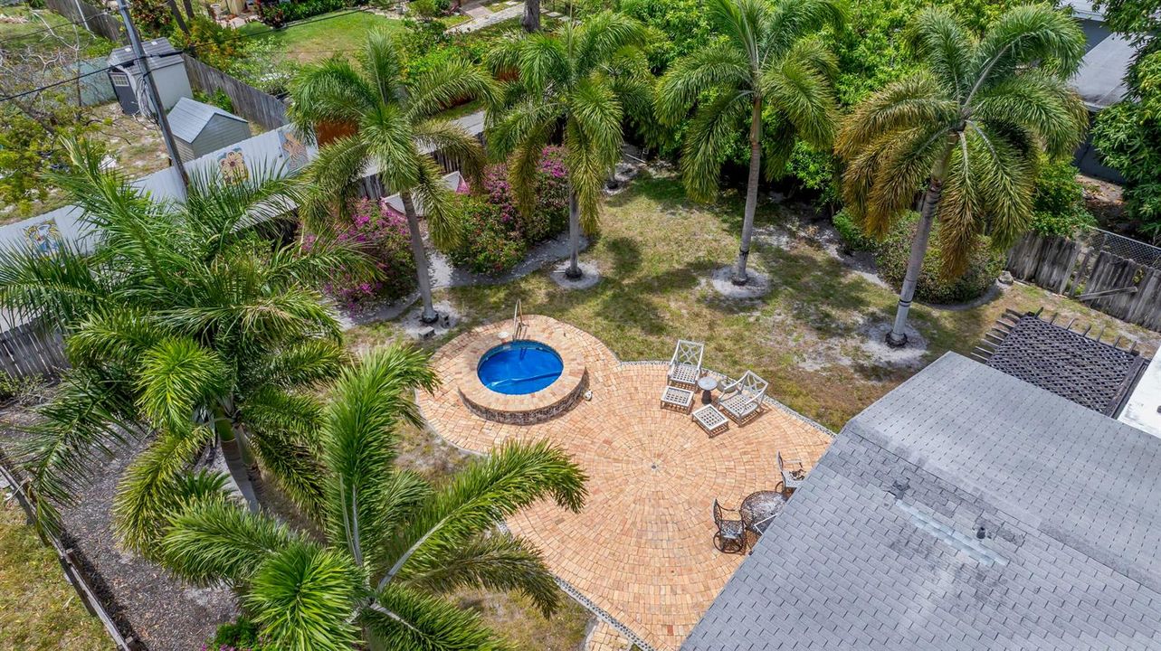 Large fenced yard with inground spa