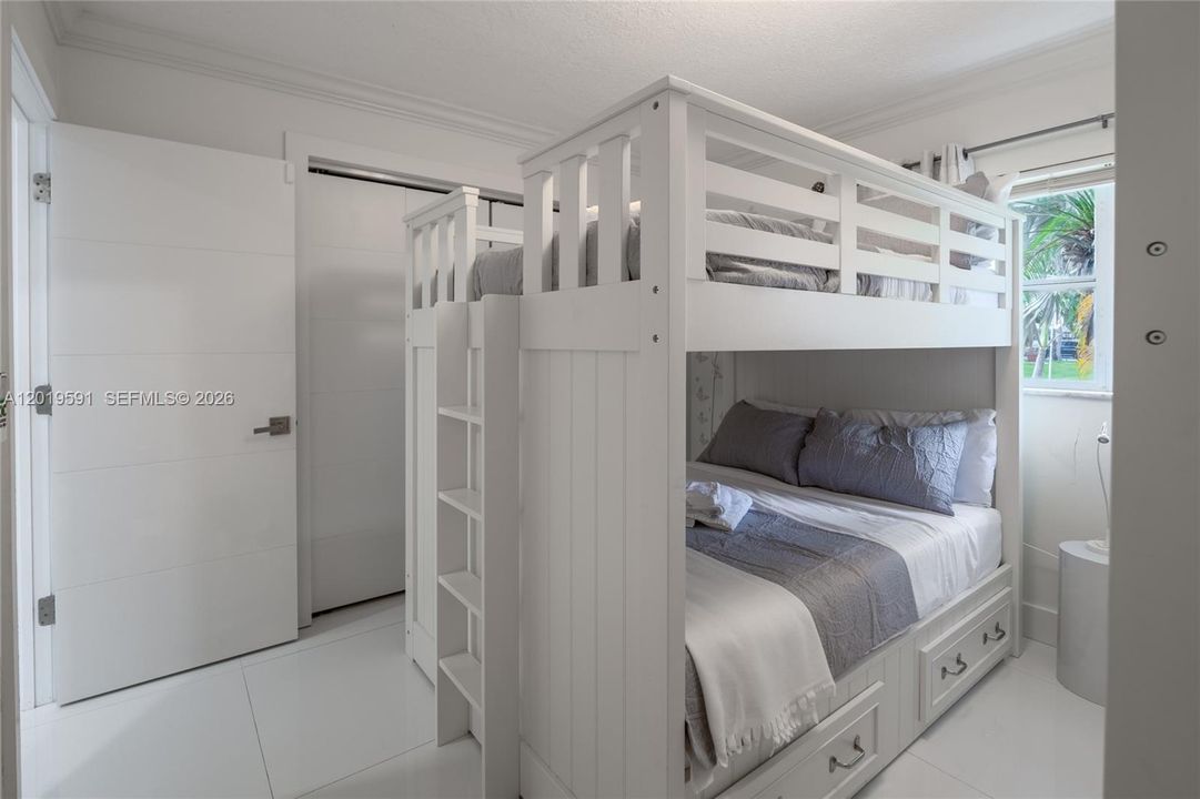 Modern bunk bedroom with stylish accommodations perfect for family and group travel experiences.