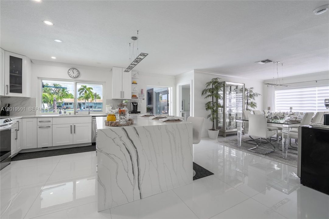 Modern open kitchen and living space designed for entertaining, comfort, and luxury vacation living.