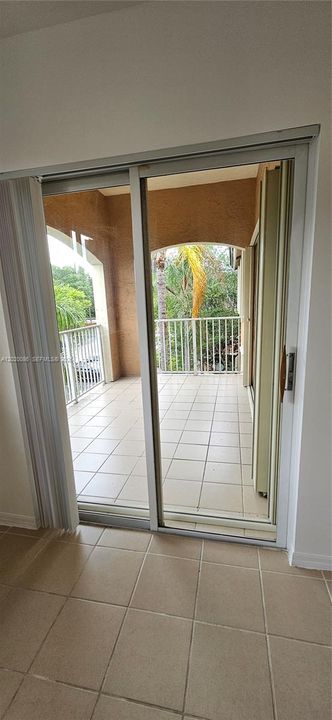 Primary Bedroom - Sliding Glass Door to Balncony