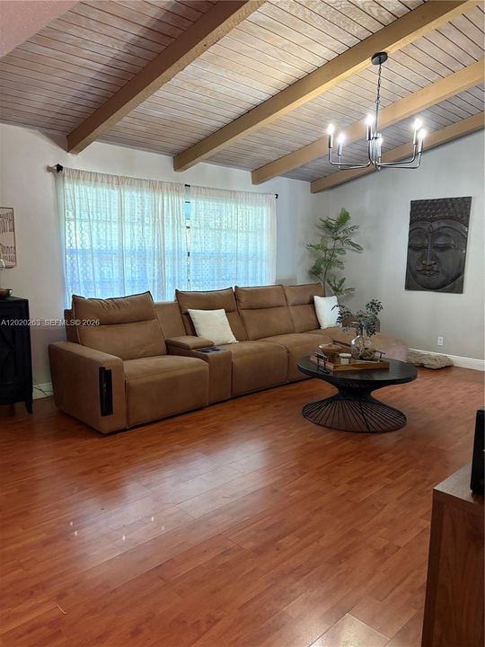 Living room with high wood beamed ceilings