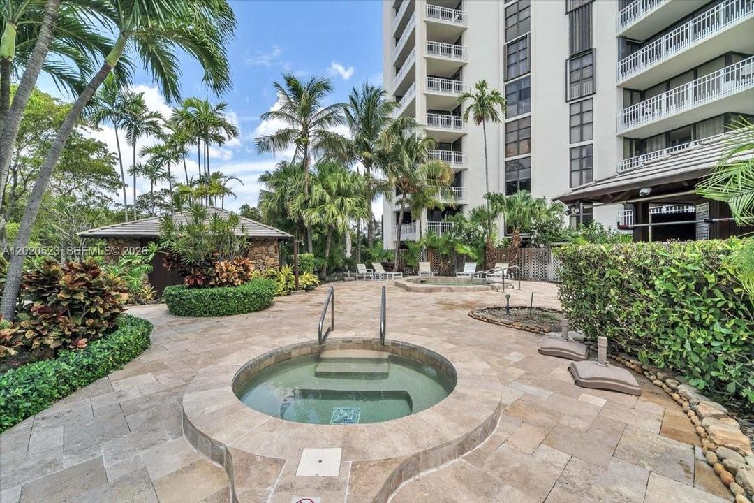 beautifully renovated pool deck and spa