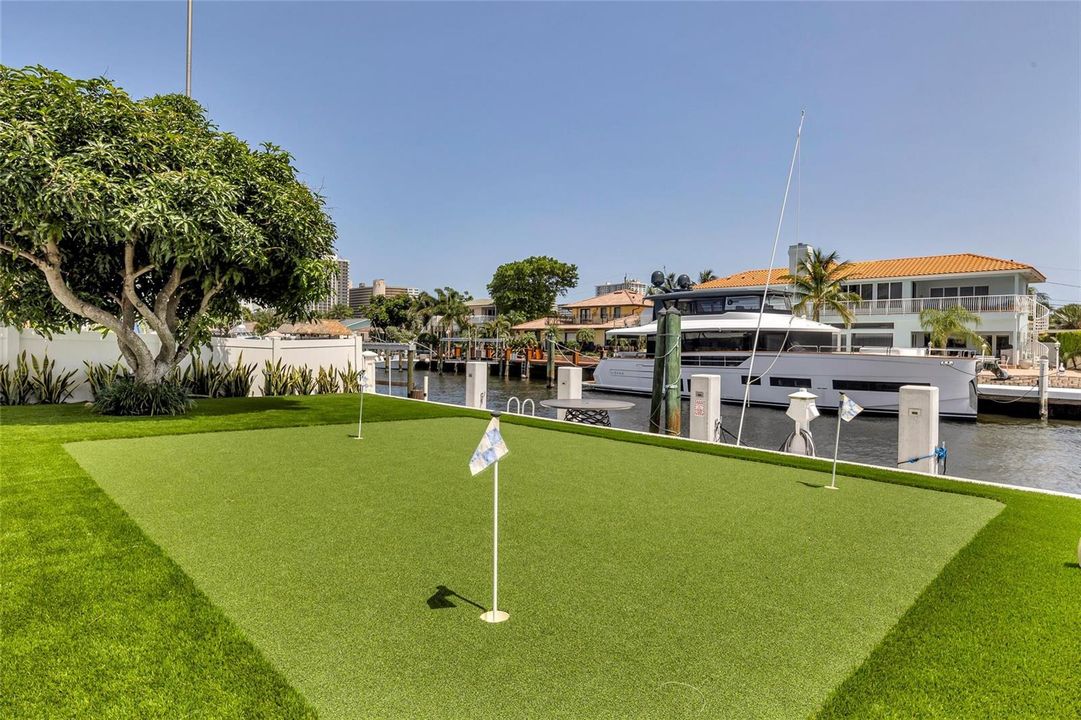Yard with putting green on the canal