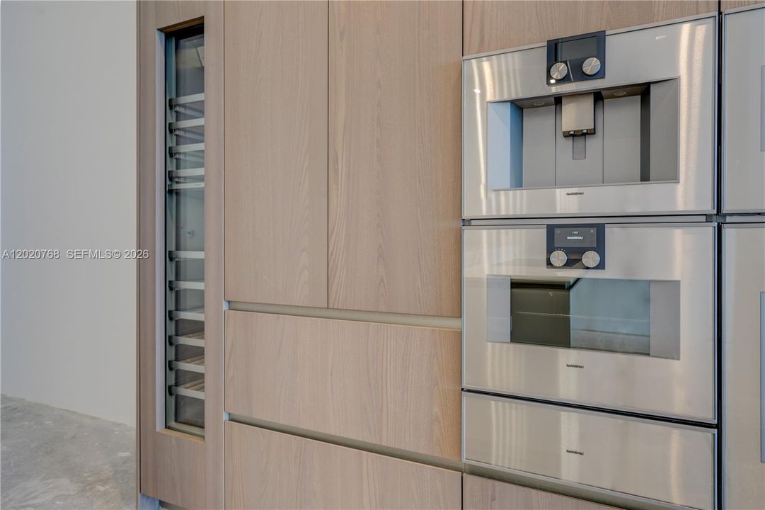 Gaggenau® appliances: warming drawer, steam oven, integrated coffee espresso/cappuccino maker.