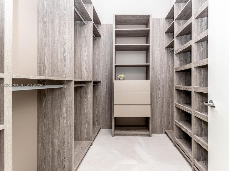 Master bedroom custom made walking closet.
