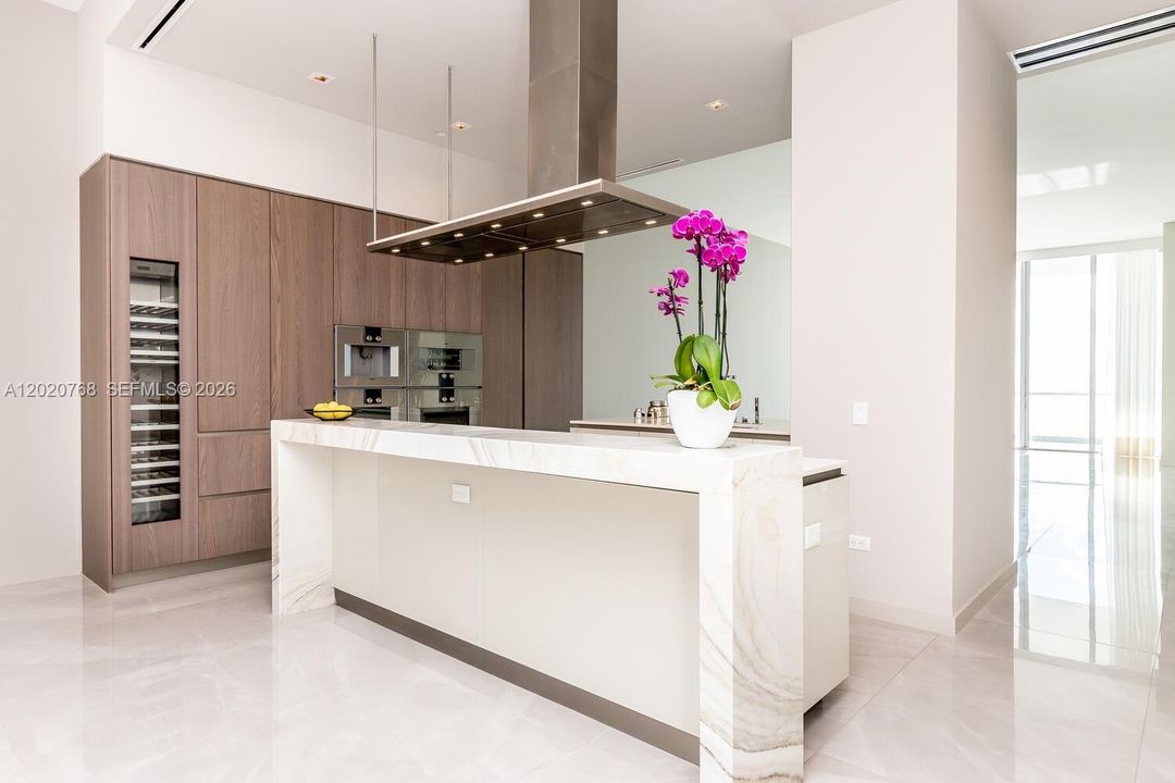Snaidero® Italian custom cabinetry in kitchens along with imported Italian stone countertops.