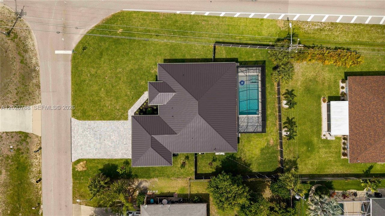 CORNER LOT location offers added accessibility, extra parking potential with convenient access to main roads!