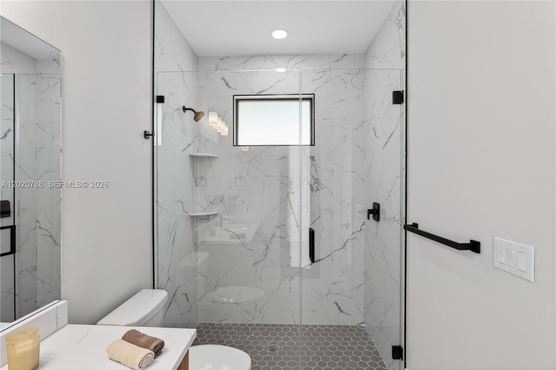 Convenient POOL BATHROOM allows easy access from outdoor living areas, perfect for entertaining & Florida pool days!