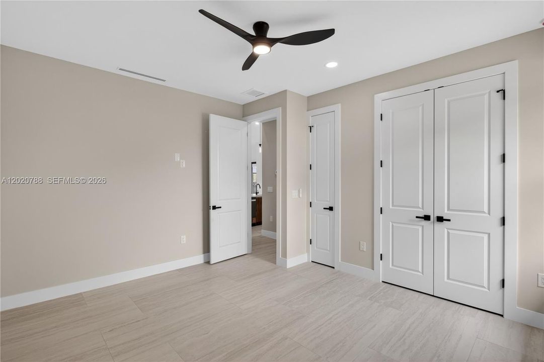 3rd Guest Bedroom with custom closet cabinetry and plenty of space :)
