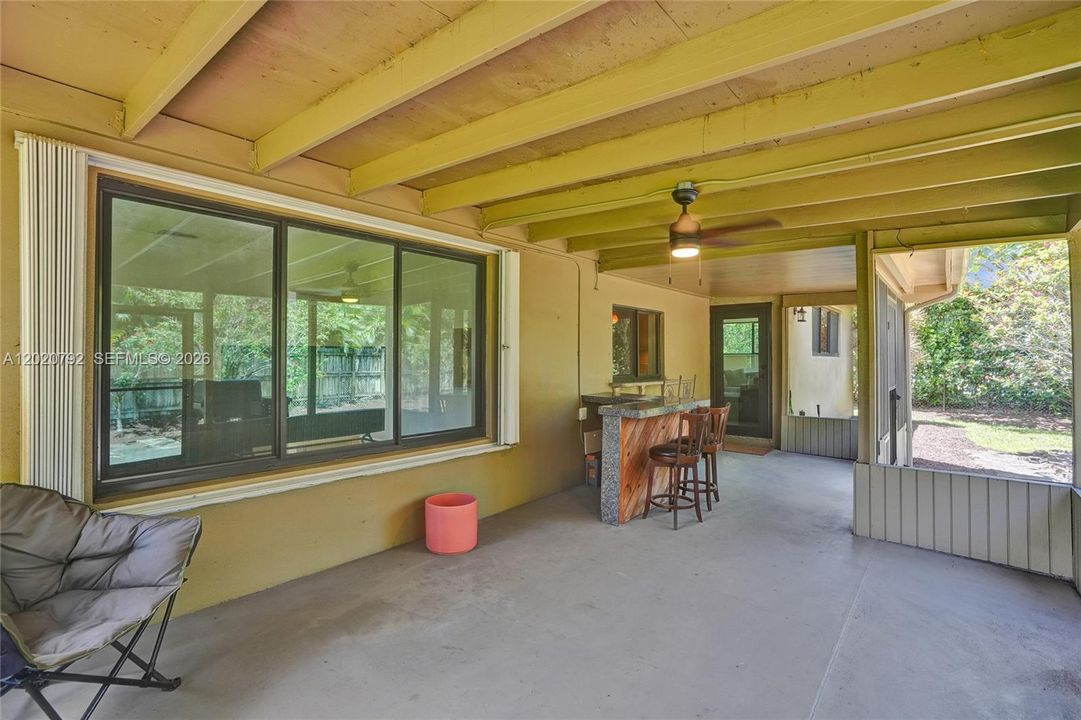 Screened in patio with outdoor bar