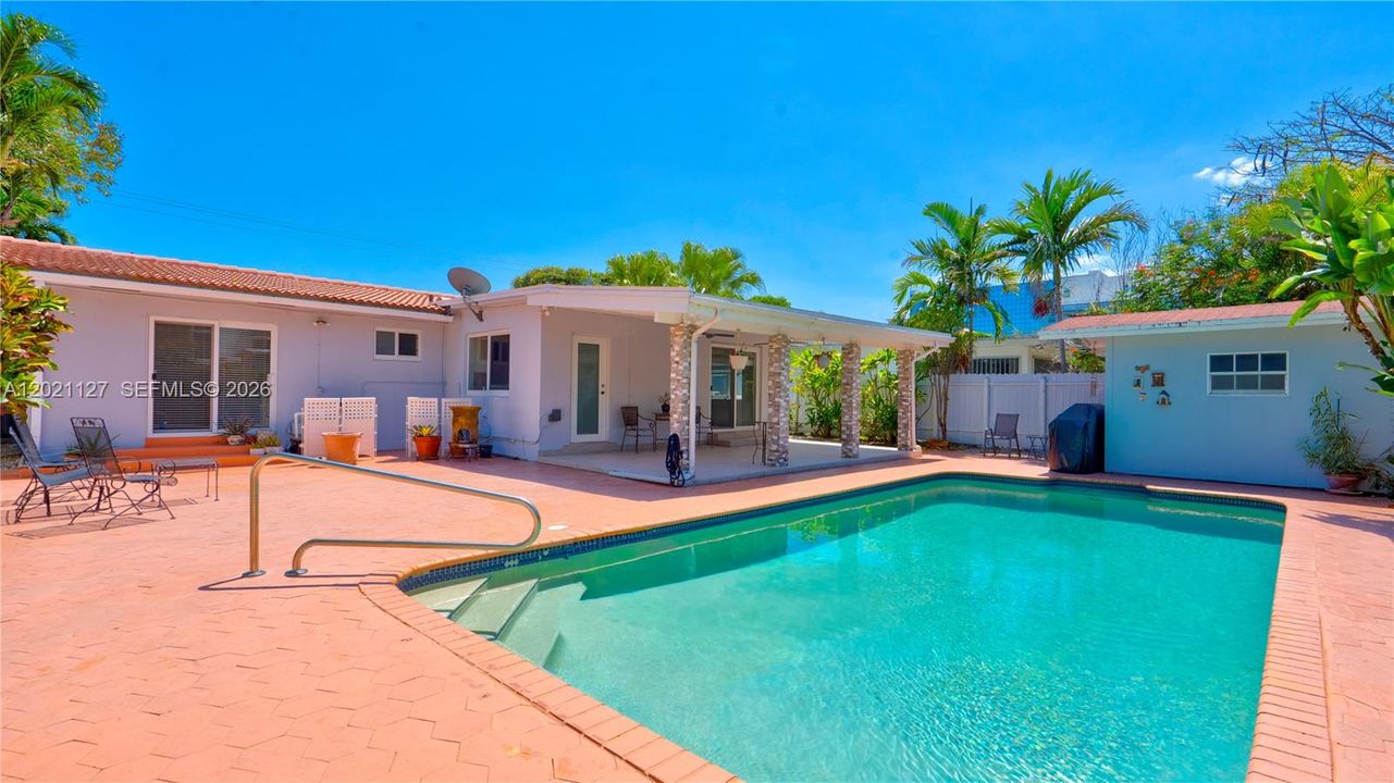 3613 - Large private backyard with pool accessible from side yard entrance, Primary bedroom, laundry room and florida room with pool deck, terrace and storage shed