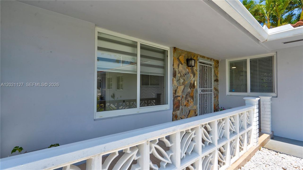 3613 Entrance porch for 3/2 with private yard and pool
