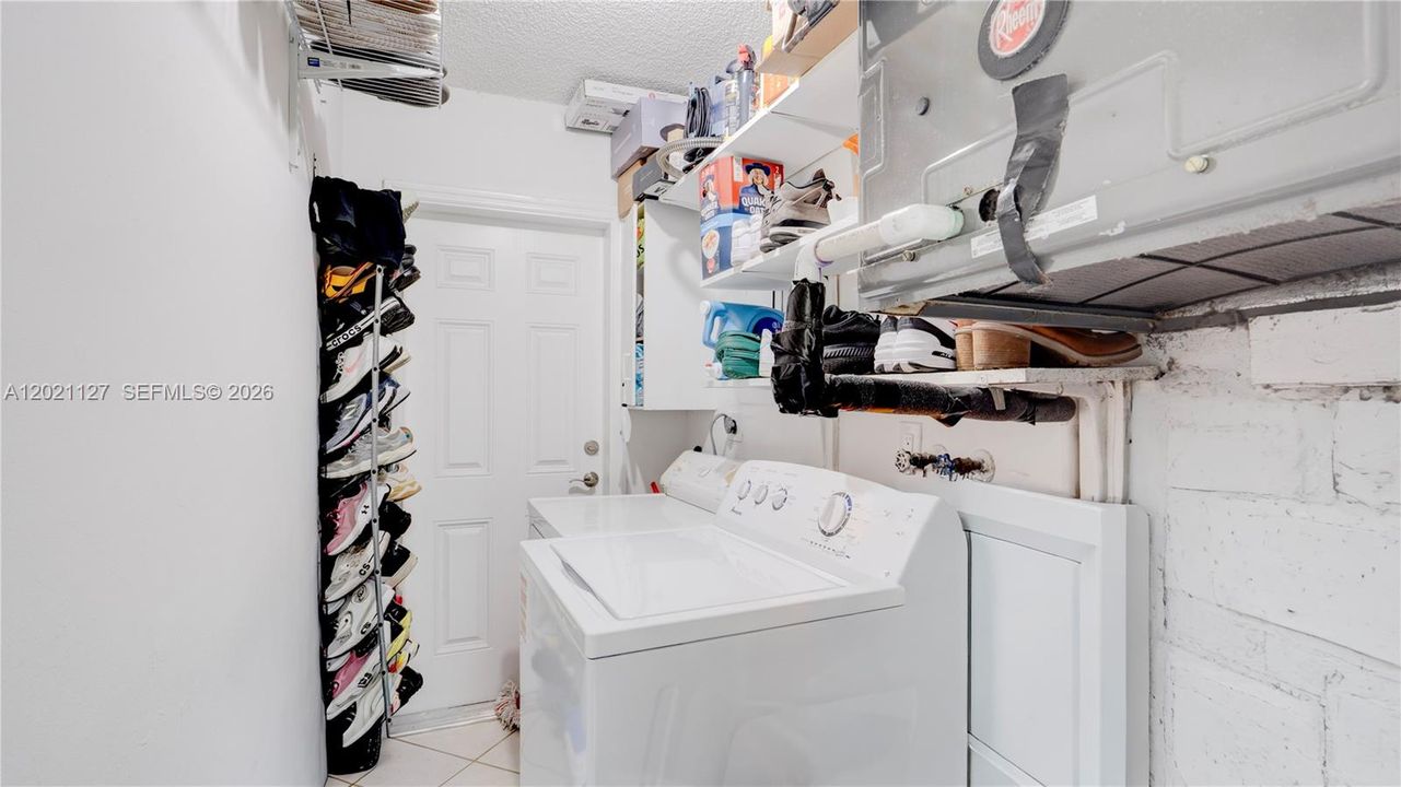 3611 - laundry room with access to side of property